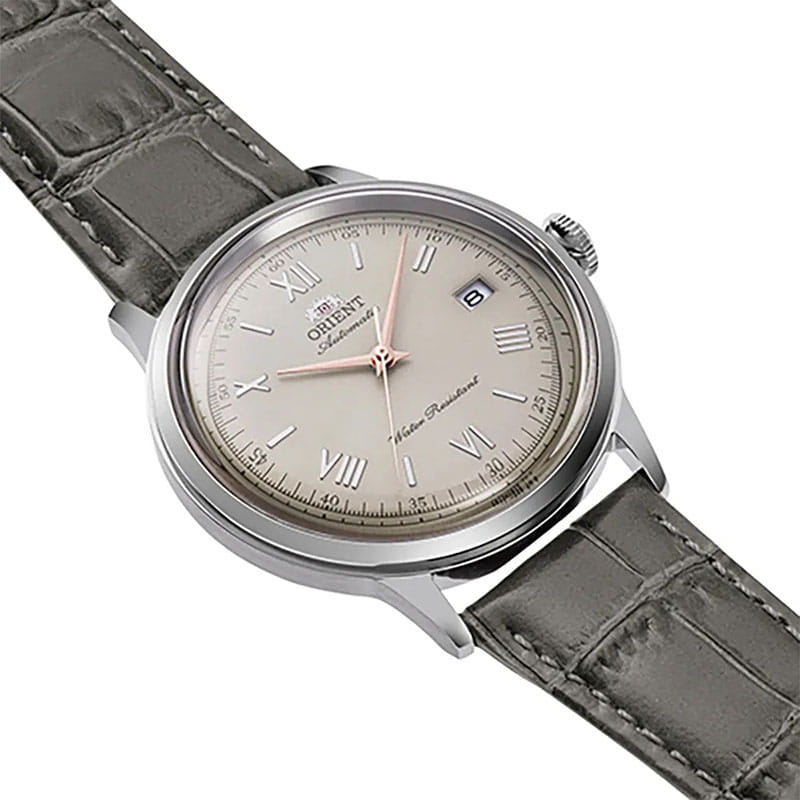 Orient Bambino Automatic RA-AC0025N30B - beżowa tarcza ze szlifem słonecznym i złotymi cyframi rzymskimi
