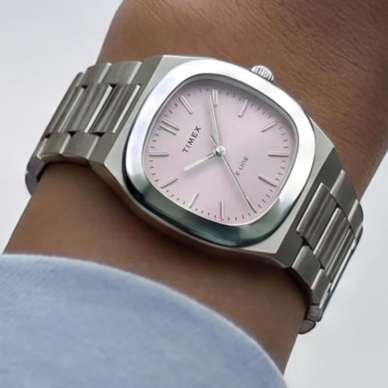 Timex E Line Quartz TW6A01000 - zegarek z różową tarczą na stalowej bransolecie na nadgarstku