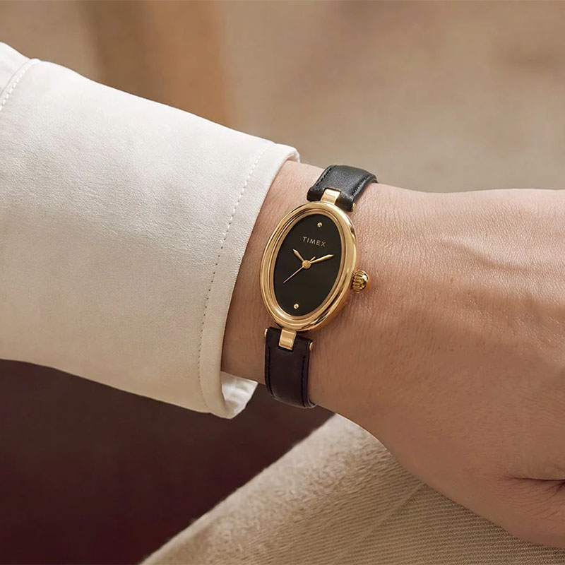 Timex Cavatina Luxe TW2Y86300 - zegarek z czarną tarczą złotą kopertą i czarnym paskiem na nadgarstku